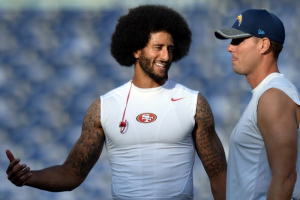 San Francisco 49ers quarterback Colin Kaepernick (L) talks with San Diego Chargers quarterback Philip Rivers (17) before the game at Qualcomm Stadium.  <br/>Jake Roth-USA TODAY Sports