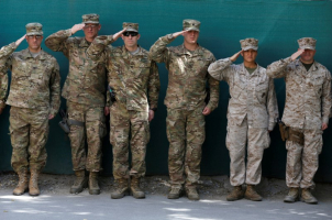U.S. soldiers salute during a memorial ceremony to commemorate the 15th anniversary of the 9/11 attacks, in Kabul, Afghanistan September 11, 2016. REUTERS/Omar Sobhani <br/>