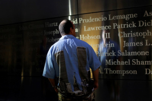 Steven Monetti Jr. reads names on the Empty Sky memorial on the morning of the 15th anniversary of the 9/11 attacks in New Jersey, U.S., September 11, 2016.  REUTERS/Andrew Kelly <br/>