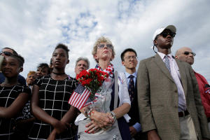 People watch as U.S. President Barack Obama, Defense Secretary Ash Carter and Joint Chiefs Chair Gen. Joseph Dunford take part in a ceremony marking the 15th anniversary of the 9/11 attacks at the Pentagon in Washington, U.S., September 11, 2016.      REUTERS/Joshua Roberts <br/>