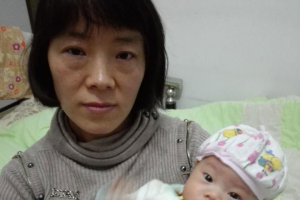 Li Aijie pictured with her infant son, Mandela. <br/>Radio Free Asia