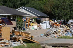 Debris is seen piled up in front of flood damaged homes in Prairieville, Louisiana, U.S., August 22, 2016.  <br/>REUTERS/Jonathan Bachman