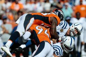 Denver Broncos outside linebacker Von Miller (58) jumps over outside linebacker DeMarcus Ware (94) and Indianapolis Colts tackle Anthony Castonzo (74) to sack quarterback Andrew Luck (12) in the second quarter at Sports Authority Field at Mile High.  <br/>Isaiah J. Downing-USA TODAY Sports