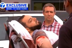 A still image captured from a video from WABC television shows a conscious man believed to be New York bombing suspect Ahmad Khan Rahami being loaded into an ambulance after a shoot-out with police in Linden, New Jersey, U.S., September 19, 2016. Courtesy WABC-TV via REUTERS <br/>