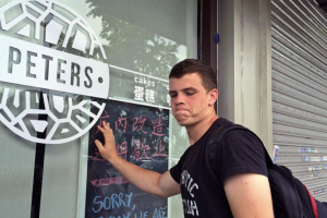 Peter Garratt, one of the sons of Canadian couple Kevin and Julia Dawn Garratt, who were being investigated in China for threatening national security, stands outside his parents' coffee shop in Dandong, Liaoning province, China, back in 2014 when the ordeal first commenced. <br/>