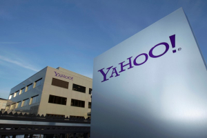 A Yahoo logo is pictured in front of a building in Rolle, 30 km (19 miles) east of Geneva, December 12, 2012. REUTERS/Denis Balibouse/File photo <br/>