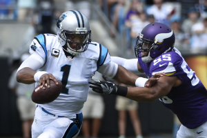 Carolina Panthers quarterback Cam Newton (1) with the ball as Minnesota Vikings outside linebacker Anthony Barr (55) defends in the first quarter at Bank of America Stadium.  <br/>Bob Donnan-USA TODAY Sports