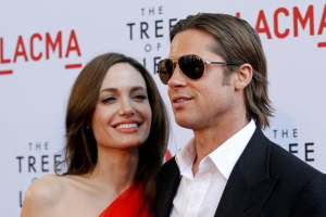 Cast member Brad Pitt and actress Angelina Jolie pose at the premiere of 
