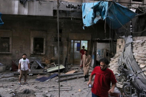 Medics inspect the damage outside a field hospital after an airstrike in the rebel-held al-Maadi neighbourhood of Aleppo, Syria, September 28, 2016. REUTERS/Abdalrhman Ismail <br/>
