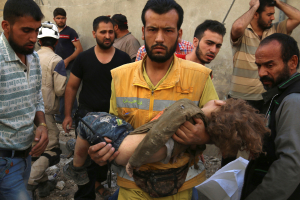 A medic holds a dead child after airstrikes in the rebel held Karam Houmid neighbourhood in Aleppo, Syria October 4, 2016. <br />
<br />
 <br/>REUTERS/Abdalrhman Ismail