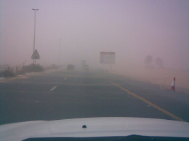Driving through a sandstorm, Dubai bound from Sharjah on E 611 Road in the United Arab Emirates. <br/>Wikimedia Commons