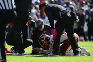 Washington Redskins medical staff tend to cornerback Josh Norman (24) as he lays on the field during the first quarter against the Baltimore Ravens at M&T Bank Stadium. <br/>Tommy Gilligan-USA TODAY Sports