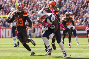 New England Patriots running back James White (28) gets tackled by Cleveland Browns cornerback Joe Haden (23) during the first quarter at FirstEnergy Stadium.  <br/>Scott R. Galvin-USA TODAY Sports