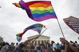 Supporters of gay marriage wave the rainbow flag after the United States Supreme Court ruled on June 26, 2015, that the US Constitution provides same-sex couples the right to marry. <br/>Reuters/Joshua Roberts