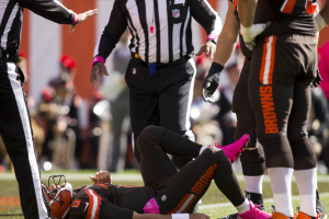 Cleveland Browns quarterback Cody Kessler (6) lays on the ground with an injury after a hit against the New England Patriots during the first quarter at FirstEnergy Stadium.  <br/>Scott R. Galvin-USA TODAY Sports