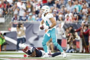Miami Dolphins tight end Jordan Cameron (84) celebrates a touchdown during the fourth quarter against the New England Patriots at Gillette Stadium. The New England Patriots won 31-24.  <br/>Greg M. Cooper-USA TODAY Sports