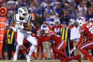 Buffalo Bills cornerback Kevon Seymour (29) tries to tackle New York Jets wide receiver Eric Decker (87) after a pass reception during the second half at New Era Field. The Jets beat the Bills 37-31.  <br/>Mandatory Credit: Kevin Hoffman-USA TODAY Sports