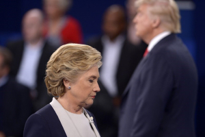 Republican U.S. presidential nominee Donald Trump and Democratic U.S. presidential nominee Hillary Clinton pause at the conclusion of their presidential town hall debate at Washington University in St. Louis, Missouri, U.S., October 9, 2016. REUTERS/Saul Loeb/Pool <br/>