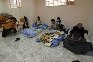 A family of Karim Patros Thomas, 51, 2nd left, resting on the floor at Our Lady of Salvation Church in Baghdad, Iraq, Wednesday, Nov. 10, 2010. The family abandoned their house after militants took aim again at Baghdad's dwindling Christian community, setting off a dozen roadside bombs on Wednesday, sending terrified families fleeing their houses and their country. <br/>AP Images / Khalid Mohammed