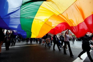 Gay rights activists hold a rainbow flag during a rally to support same-sex marriage in central Sydney in this August 11, 2012 file photo.<br />
<br />
 <br/>Reuters/Daniel Munoz 