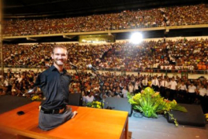 Nick Vujicic, a Christian motivational speaker and evangelist without arms or legs, speaks to a crowd in the South American country of in 2009. <br/>