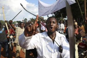 Men gesture during a protest against French soldiers in Bambari May 22, 2014. <br />
<br />
 <br/>Reuters