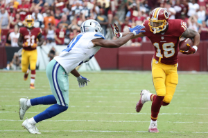 Washington Redskins wide receiver Josh Doctson (18) runs with the ball as Dallas Cowboys safety Byron Jones (31) attempts the tackle in the fourth quarter at FedEx Field. The Cowboys won 27-23.  <br/>Geoff Burke-USA TODAY Sports