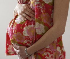 A woman holds her stomach at the last stages of her pregnancy in Bordeaux April 28, 2010. <br />
<br />
 <br/>Reuters/Regis Duvignau