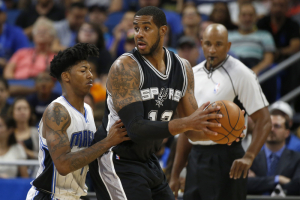 San Antonio Spurs forward LaMarcus Aldridge (12) drives to the basket as Orlando Magic guard Elfrid Payton (4) defends during the first quarter at Amway Center.  <br/>Kim Klement-USA TODAY Sports