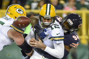 Green Bay Packers quarterback Aaron Rodgers (12) fumbles the ball after getting sacked by Chicago Bears linebacker Leonard Floyd (94) in the third quarter at Lambeau Field. Floyd recovered the fumble for a touchdown.  <br/> Benny Sieu-USA TODAY Sports