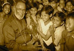 Dr. M.A. Thomas, founder of Hopegivers International, with Indian orphans in an undated photo. <br/>Hopegivers International