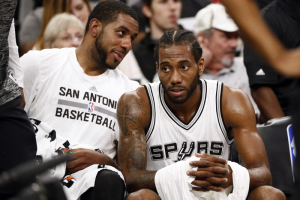 Oct 21, 2016; San Antonio, TX, USA; San Antonio Spurs power forward LaMarcus Aldridge (12, left) and Kawhi Leonard (2, right) talk on the bench during the second half against the Houston Rockets at AT&T Center.  <br/>Soobum Im-USA TODAY Sports