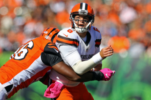 Cincinnati Bengals defensive end Carlos Dunlap (96) tackles Cleveland Browns quarterback Cody Kessler (6) as he pitches the ball in the first half at Paul Brown Stadium.  <br/>Aaron Doster-USA TODAY Sports
