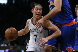 Brooklyn Nets guard Jeremy Lin (7) drives to the basket against New York Knicks center Willy Hernangomez (14) during second half at Barclays Center. The New York Knicks defeated the Brooklyn Nets 116-111.  <br/>Noah K. Murray-USA TODAY Sports