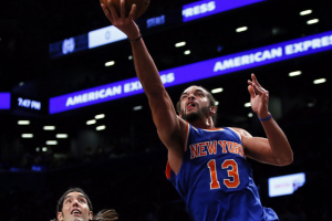 New York Knicks center Joakim Noah (13) drives to the basket against Brooklyn Nets forward Luis Scola (4) at Barclays Center.  <br/>Noah K. Murray-USA TODAY Sports
