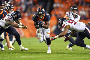 Houston Texans safety Lonnie Ballentine (39) and inside linebacker Benardrick McKinney (55) attempt to tackle a carry by Denver Broncos running back C.J. Anderson (22) in the second half at Sports Authority Field at Mile High. The Broncos defeated the Texans 27-9. <br/> Mandatory Credit: Ron Chenoy-USA TODAY Sports