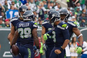  Seattle Seahawks running back C.J. Spiller (28) celebrates with Seattle Seahawks quarterback Russell Wilson (3) after he caught a touchdown against the New York Jets in the first half at MetLife Stadium.  <br/>Mandatory Credit: William Hauser-USA TODAY Sports