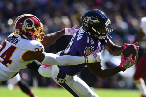Baltimore Ravens wide receiver Breshad Perriman (18) makes a catch in front of Washington Redskins cornerback Josh Norman (24) during the first quarter at M&T Bank Stadium.  <br/>Mandatory Credit: Tommy Gilligan-USA TODAY Sports