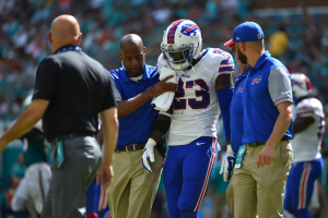 Buffalo Bills strong safety Aaron Williams (23) is helped off the field after being injured in the game against the Miami Dolphins during the first half at Hard Rock Stadium.  <br/>Mandatory Credit: Jasen Vinlove-USA TODAY Sports
