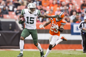 New York Jets wide receiver Brandon Marshall (15) stiff arms Cleveland Browns cornerback Joe Haden (23) during the fourth quarter at FirstEnergy Stadium. The Jets won 31-28.  <br/>Scott R. Galvin-USA TODAY Sports