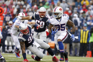 New England Patriots outside linebacker Jamie Collins (91) tries to tackle Buffalo Bills running back Mike Gillislee (35) as he runs the ball during the first half at New Era Field.  <br/>Mandatory Credit: Timothy T. Ludwig-USA TODAY Sports