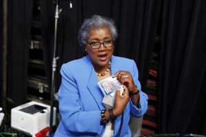 Acting DNC Chair Donna Brazile removes her CNN credential so she may participate in the Democratic National Convention in Philadelphia, Pennsylvania, U.S. July 25, 2016.<br />
<br />
 <br/>Reuters/Lucy Nicholson 