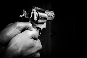 Photo showing man holding a gun <br/>Pixabay