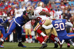 Buffalo Bills free safety Corey Graham (20) tries to make a tackle on San Francisco 49ers running back Carlos Hyde (28) during the first half at New Era Field.  <br/>Mandatory Credit: Timothy T. Ludwig-USA TODAY Sports