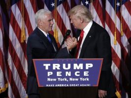 Donald Trump greets his running mate Mike Pence during his election night rally in Manhattan. REUTERS/Mike Segar <br/>