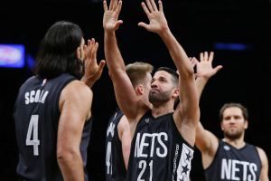 Brooklyn Nets guard Greivis Vasquez (21) and forward Luis Scola (4) react after leading in the fourth quarter against the Indiana Pacers during second half at Barclays Center. The Nets won 103-94. <br/>Mandatory Credit: Noah K. Murray-USA TODAY Sports