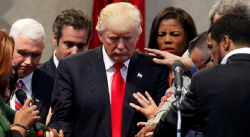 Members of the clergy lay hands and pray over Republican presidential nominee Donald Trump at the New Spirit Revival Center in Cleveland Heights, Ohio, U.S., September 21, 2016. <br />
<br />
 <br/>Reuters/Jonathan Ernst 
