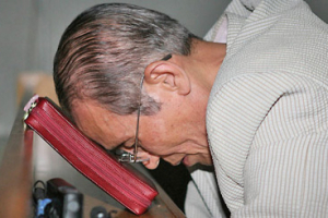 Church elder Bae Hyo-joong, father of 42-year-old pastor Bae Hyung-kyu, who was reportedly slain by the Taliban in Afghanistan, leans his head on a Bible after hearing news of his son's death. <br/>(Photo: Christian Today Korea, Song Kyung-ho)