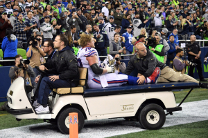 Buffalo Bills center Eric Wood (70) is taken off the field with a leg injury during a NFL football game against the Seattle Seahawks at CenturyLink Field. The Seahawks defeated the Bills 31-25.  <br/>Mandatory Credit: Kirby Lee-USA TODAY Sports