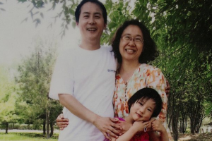Imprisoned lawyer Li Heping, hi wife Wang Qiaoling and daughter Li Jia We at home in Beijing.  <br/>Adam Dean/THE GUARDIAN